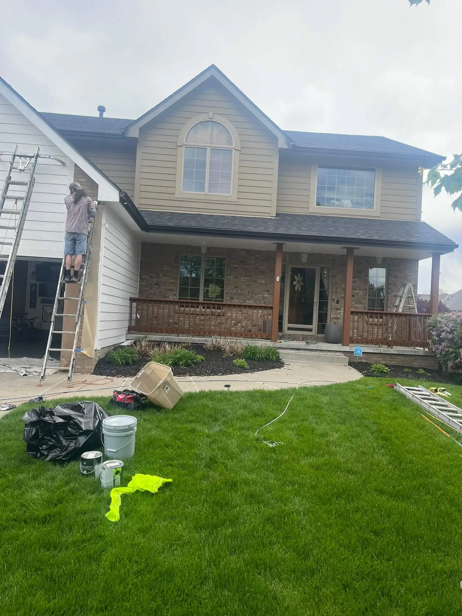 John Moran Painting hard at work painting a house.