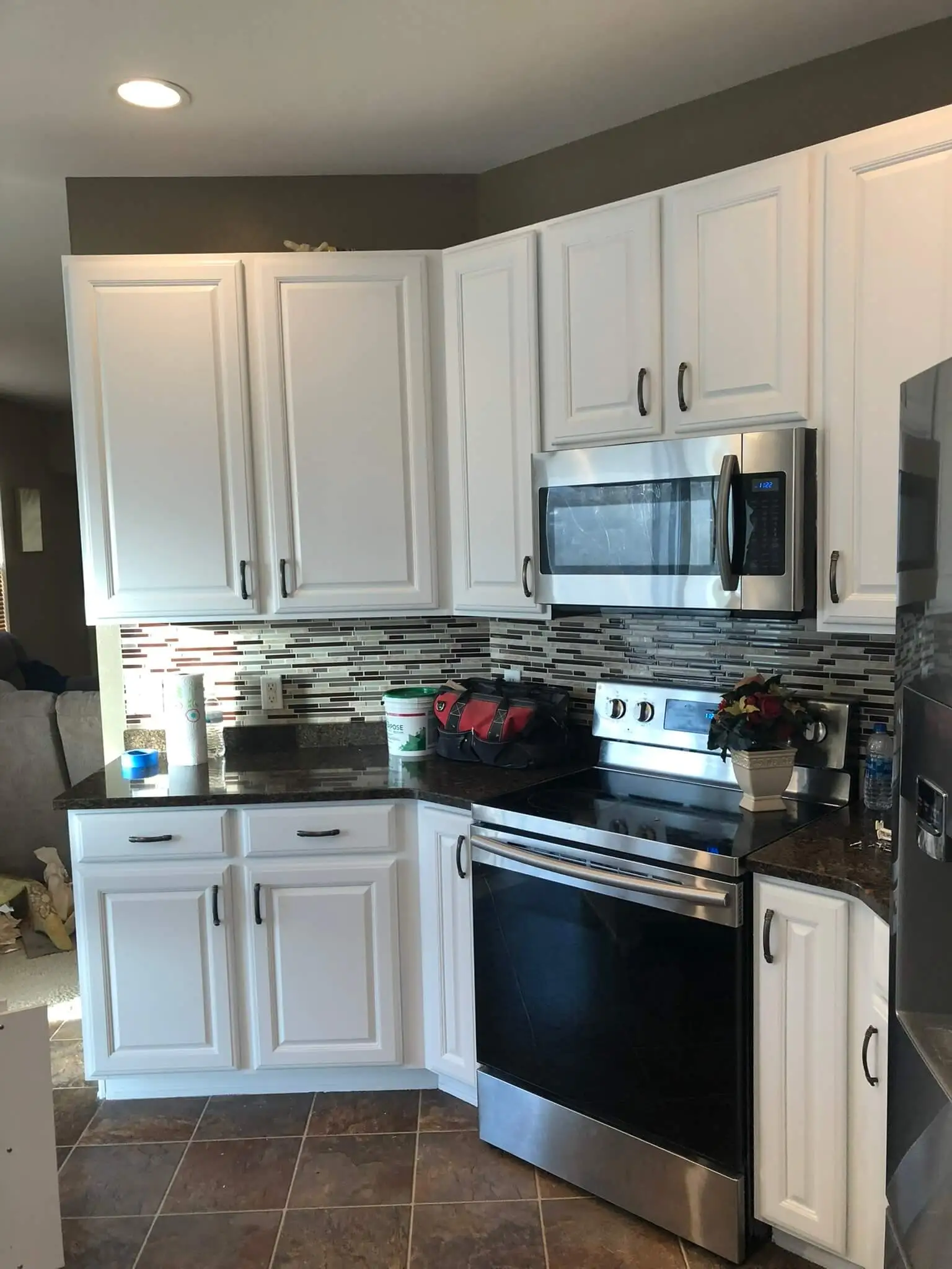 A kitchen with newly painted cupboards.