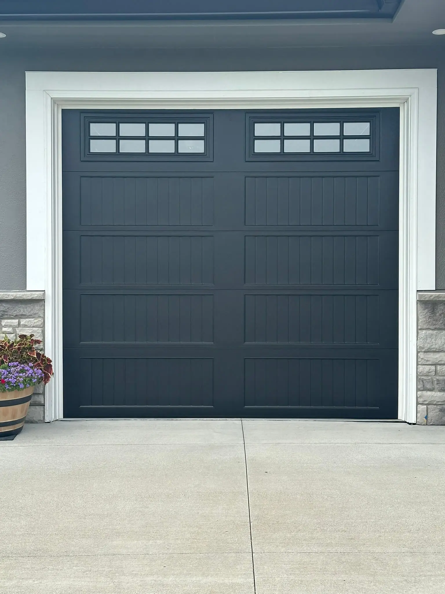 A blue garage door with fresh paint.